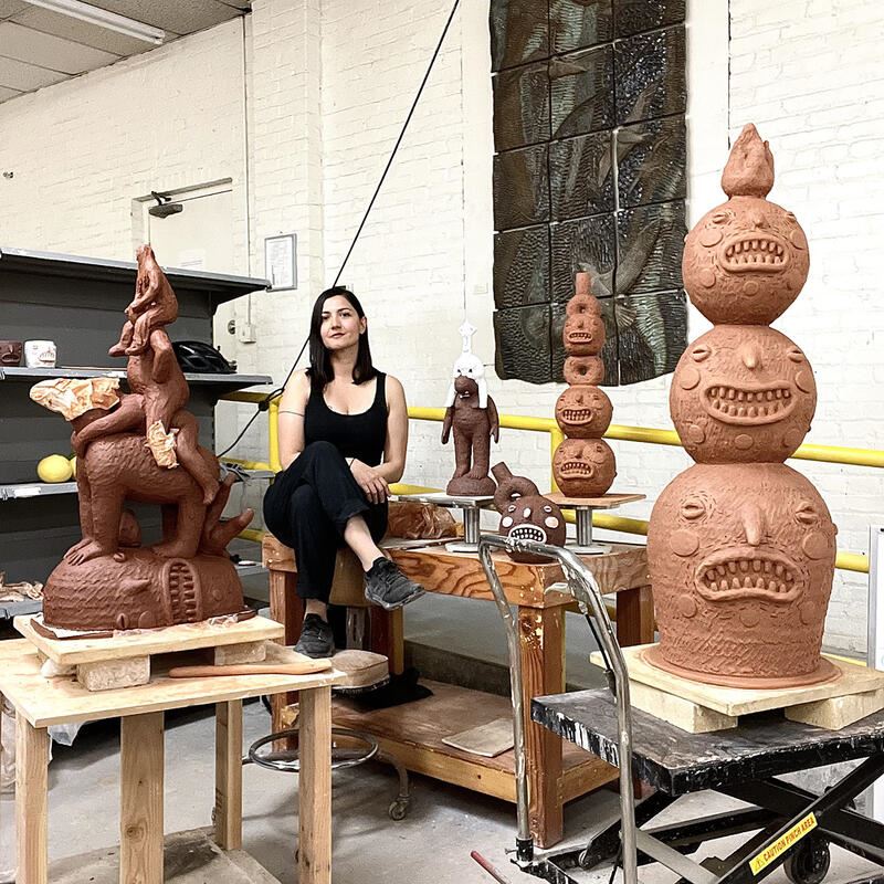 Natalia in her studio surrounded by scultpturs